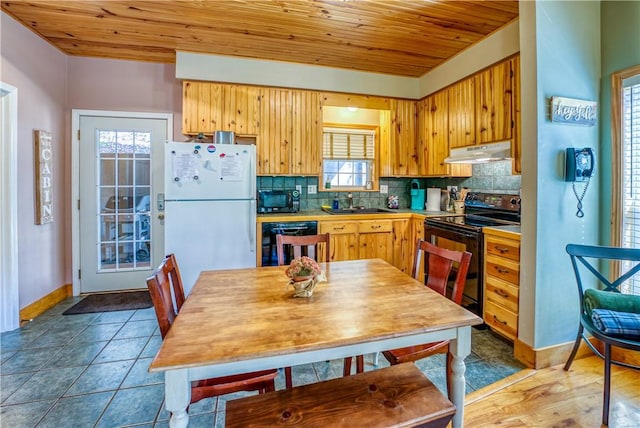 kitchen with tasteful backsplash, plenty of natural light, wooden ceiling, and black appliances