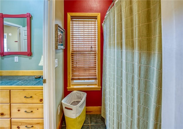 bathroom with tile patterned floors