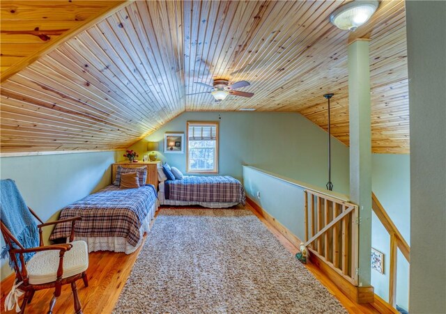 bedroom with ceiling fan, hardwood / wood-style floors, wooden ceiling, and lofted ceiling