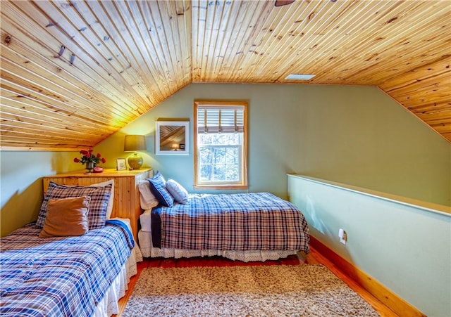 bedroom featuring hardwood / wood-style floors, wooden ceiling, and vaulted ceiling