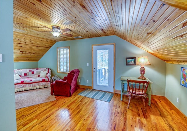 interior space with access to outside, ceiling fan, lofted ceiling, and light hardwood / wood-style floors