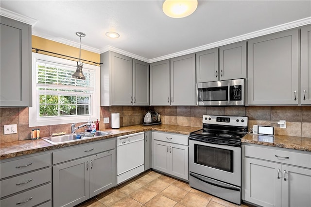 kitchen featuring gray cabinetry, ornamental molding, sink, and stainless steel appliances