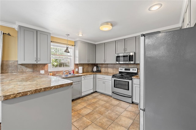 kitchen featuring pendant lighting, gray cabinets, stainless steel appliances, and ornamental molding