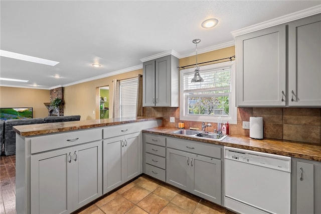 kitchen featuring kitchen peninsula, dishwasher, gray cabinets, ornamental molding, and sink