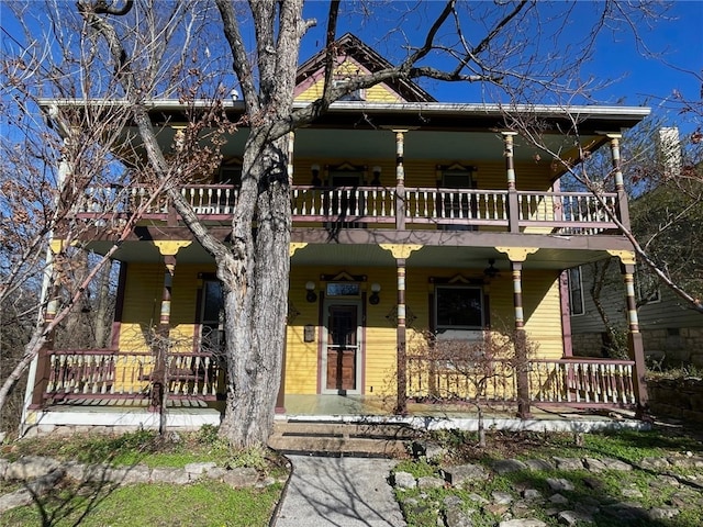 view of front facade featuring a balcony and covered porch