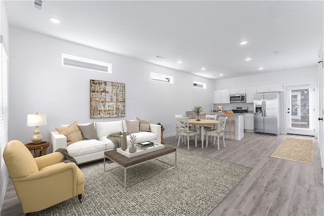 living room with light wood-type flooring