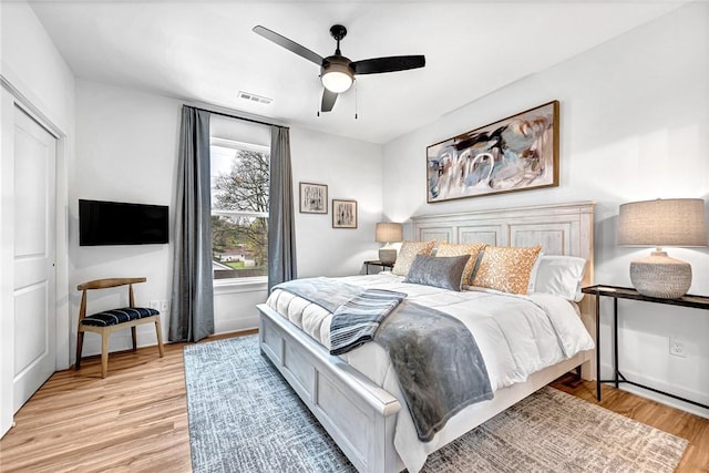 bedroom featuring ceiling fan and light wood-type flooring