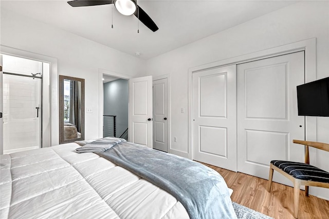 bedroom with hardwood / wood-style flooring, a closet, and ceiling fan