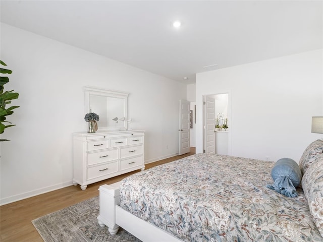 bedroom with hardwood / wood-style flooring