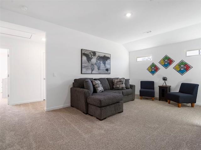 carpeted living room with vaulted ceiling