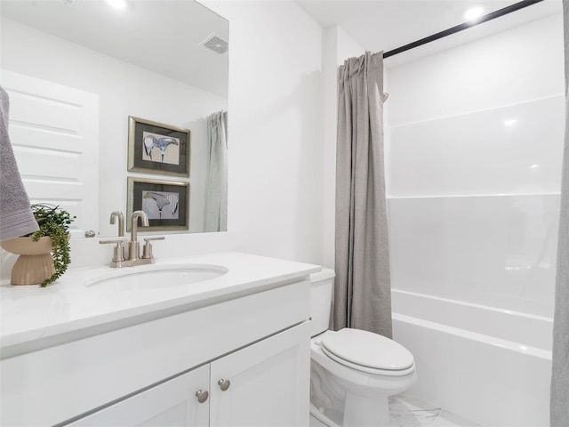 full bathroom with vanity, shower / tub combo, and toilet