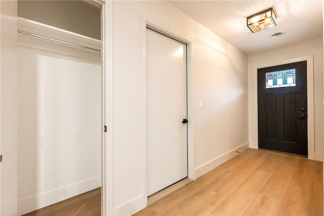 foyer entrance with light wood-type flooring