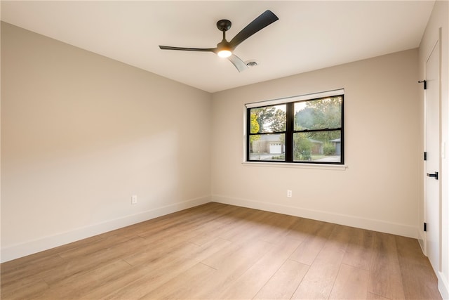 unfurnished room featuring light hardwood / wood-style floors and ceiling fan