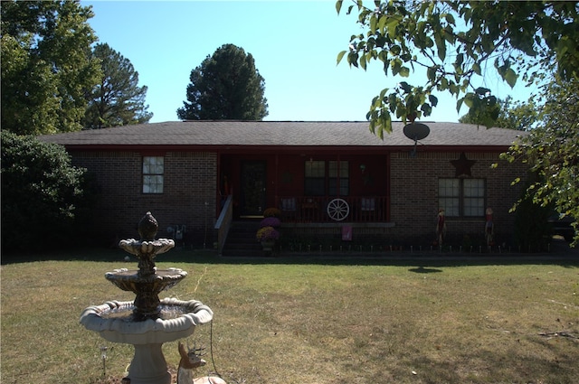 ranch-style home with a front lawn