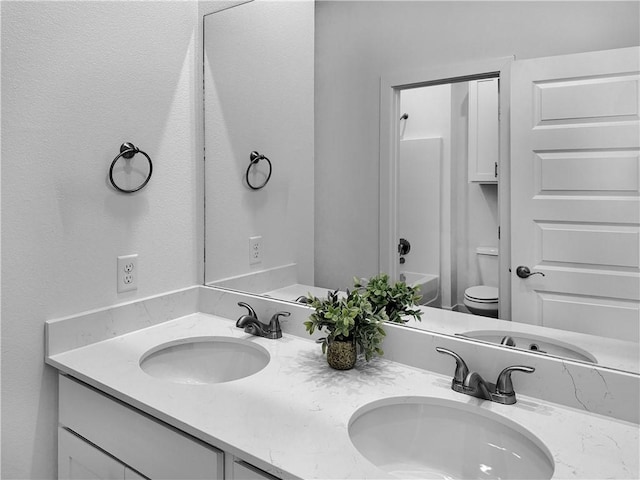 full bathroom featuring vanity, toilet, and shower / bath combination