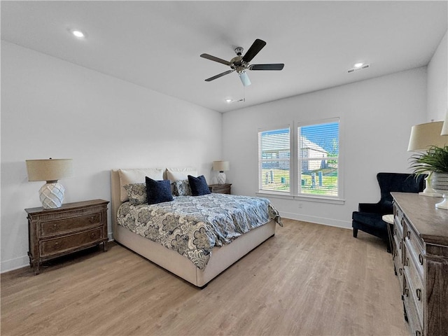 bedroom with ceiling fan and light wood-type flooring