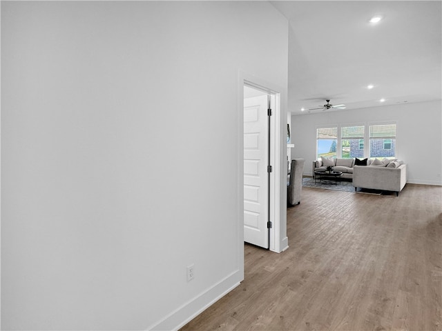 hallway with light hardwood / wood-style flooring