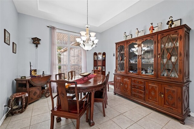 dining room featuring an inviting chandelier and light tile patterned floors