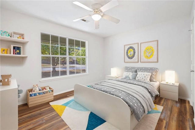 bedroom featuring ceiling fan and dark hardwood / wood-style floors