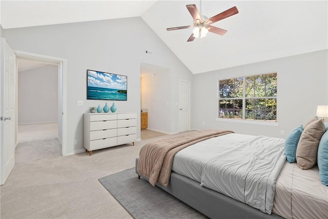 carpeted bedroom featuring connected bathroom, ceiling fan, and high vaulted ceiling