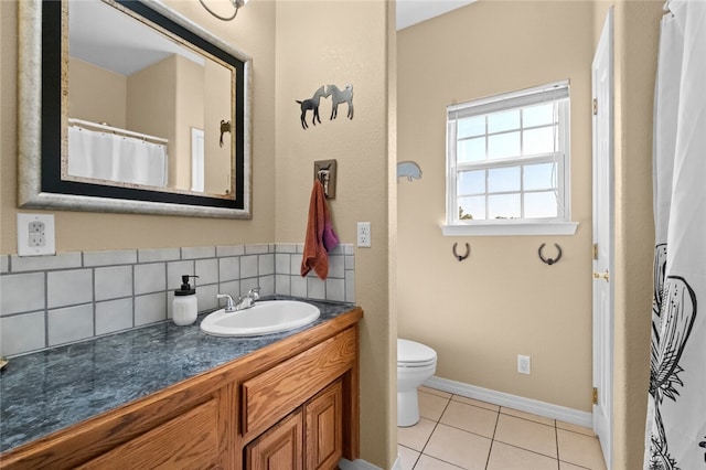 bathroom featuring vanity, backsplash, toilet, and tile patterned flooring