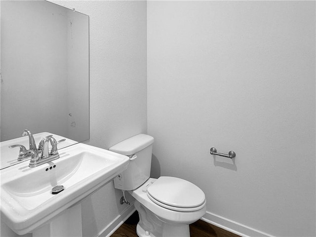 5395 Selah St, Springdale, AR 72764 - half bath featuring toilet and wood finished floors