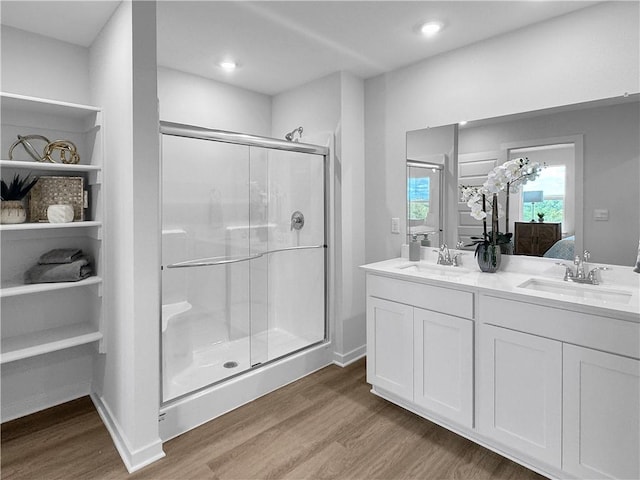 5395 Selah St, Springdale, AR 72764 - ensuite bathroom with wood finished floors, a stall shower, double vanity, and recessed lighting