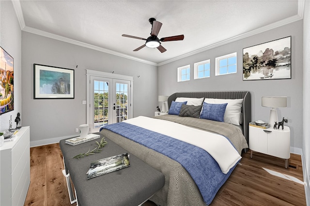 bedroom with access to outside, dark hardwood / wood-style flooring, ornamental molding, ceiling fan, and french doors