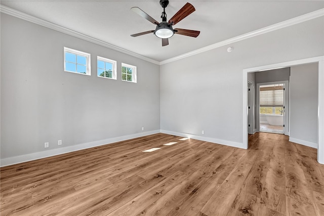 spare room with light hardwood / wood-style floors, ceiling fan, and crown molding