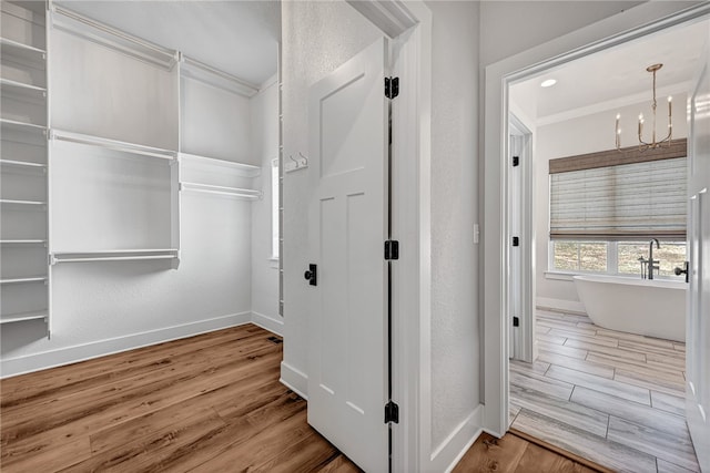 interior space featuring an inviting chandelier and hardwood / wood-style flooring