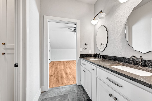 bathroom featuring ceiling fan, hardwood / wood-style flooring, and vanity