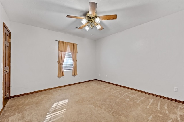 spare room with carpet flooring and ceiling fan