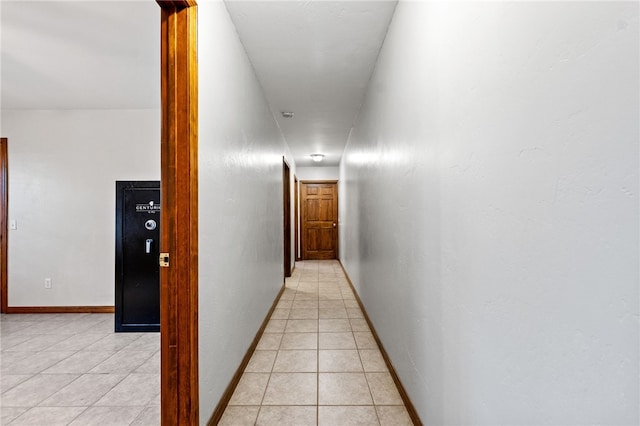 corridor featuring light tile patterned flooring