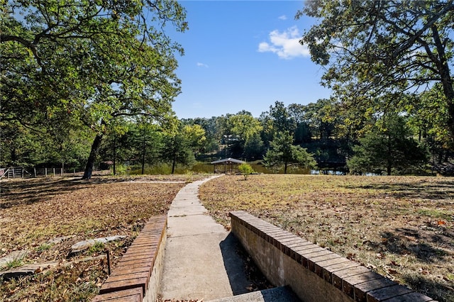 surrounding community with a water view