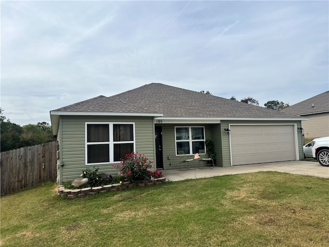 ranch-style home featuring a garage and a front lawn