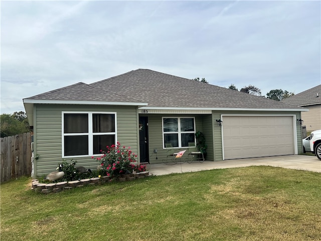 single story home with a garage and a front yard