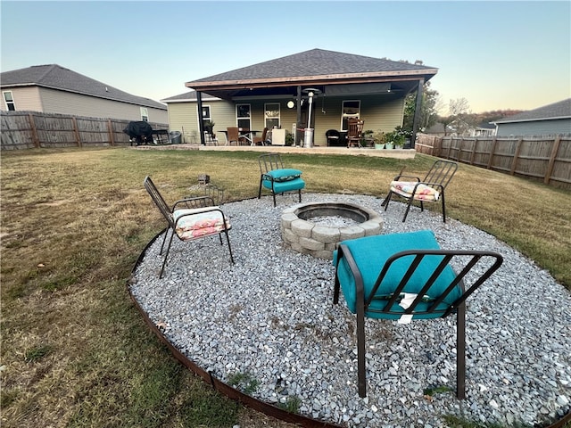 exterior space with a fire pit and a patio area