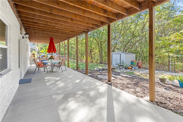 view of patio / terrace with a storage unit