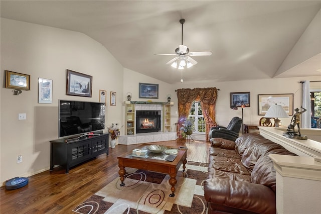 living room featuring a fireplace, dark hardwood / wood-style flooring, ceiling fan, and lofted ceiling