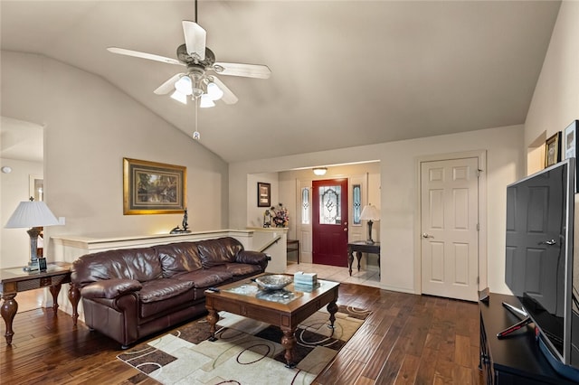 living room featuring ceiling fan, hardwood / wood-style floors, and lofted ceiling