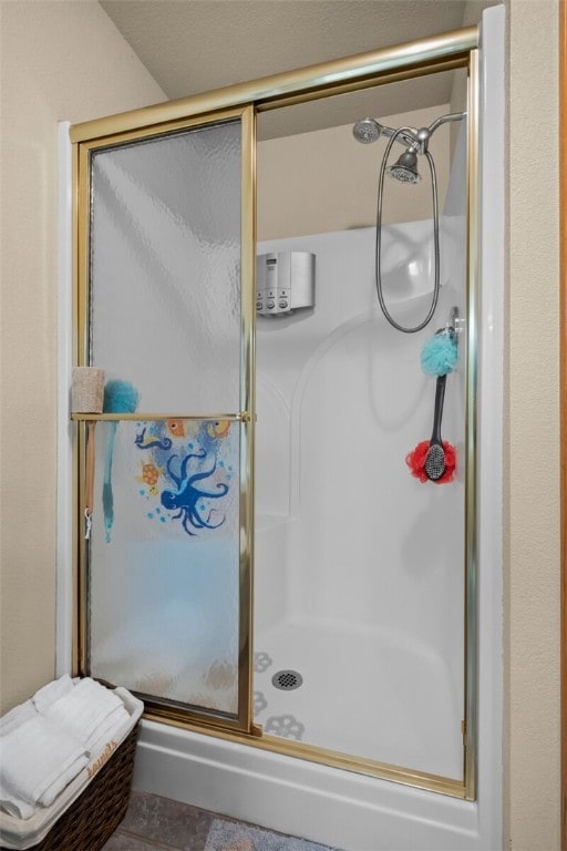 bathroom featuring an enclosed shower