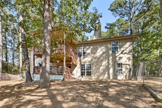 back of property with a wooden deck