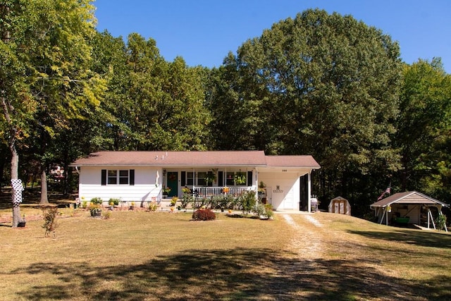 single story home with a front yard, a porch, and a carport