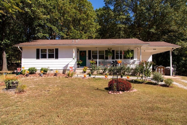 ranch-style home with covered porch, a front yard, and a carport