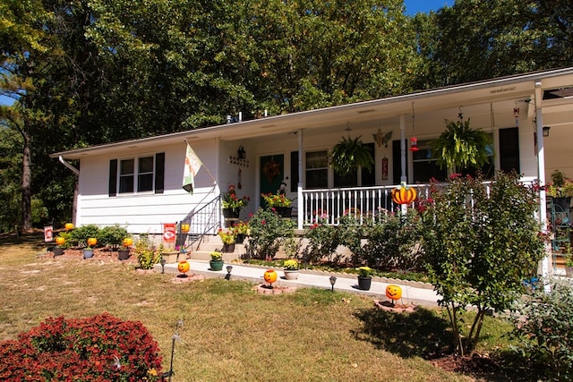 view of front of home featuring a front yard and covered porch