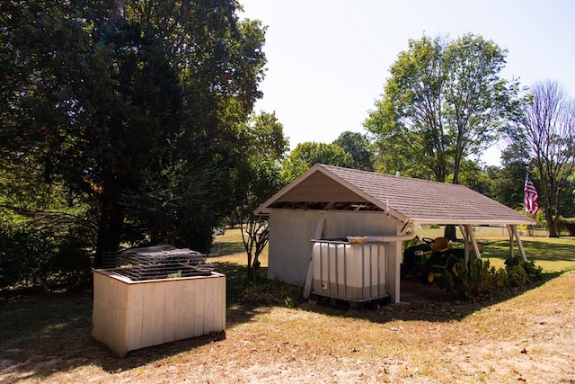 view of outdoor structure with a lawn