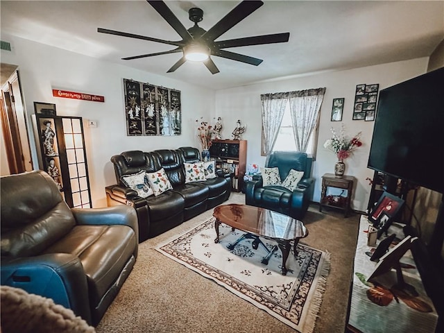 living room featuring ceiling fan and carpet flooring