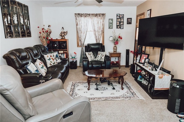 carpeted living room with ceiling fan