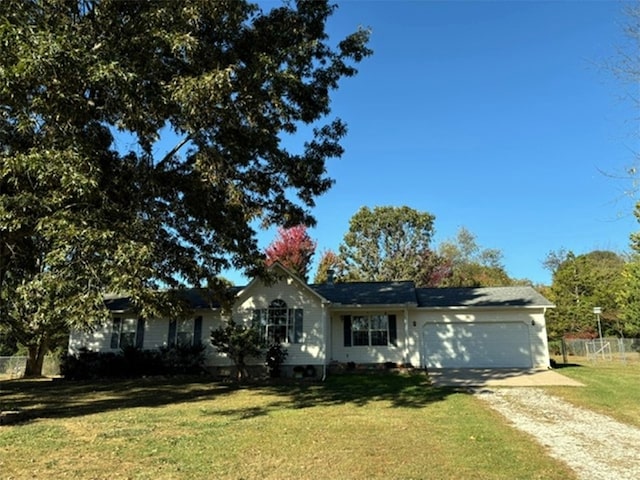 single story home featuring a garage and a front lawn