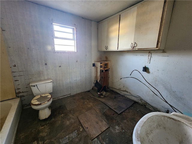 bathroom with a bathtub and toilet